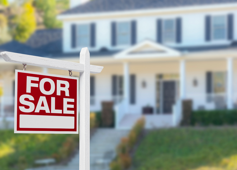 House for sale sign in front yard