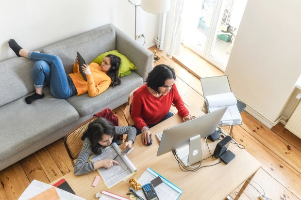 Family working and studying together at home