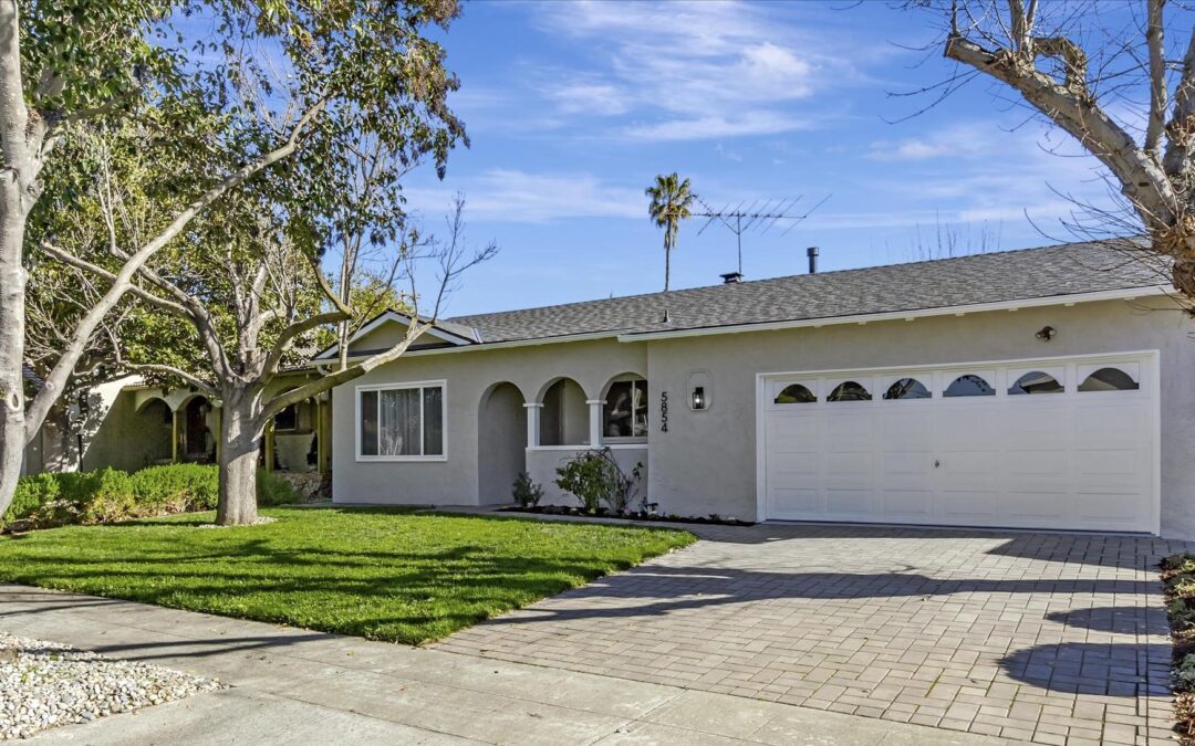 Single-story suburban home with garage and lawn